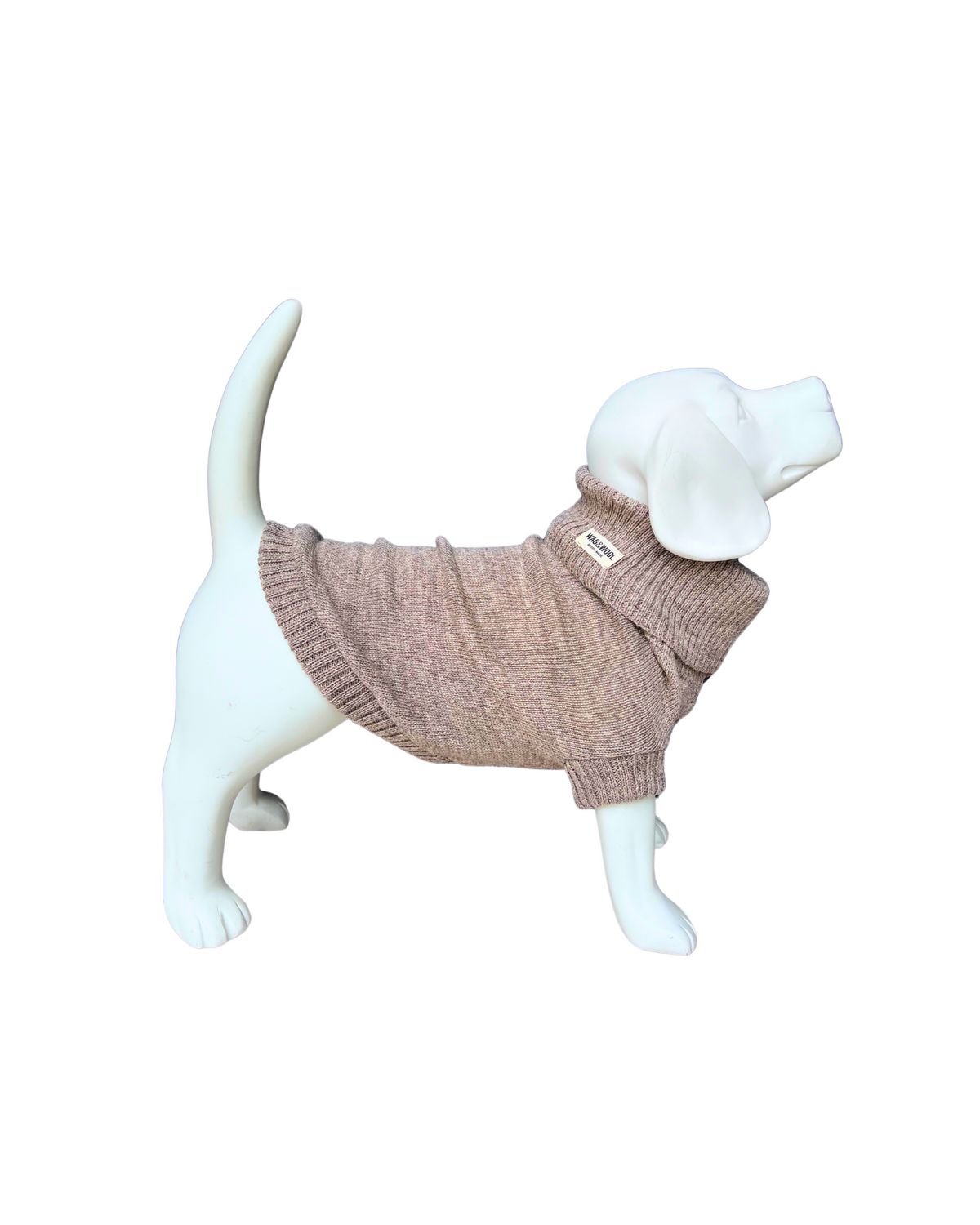 A small dog-shaped mannequin wearing a ribbed knit sweater in oatmeal
