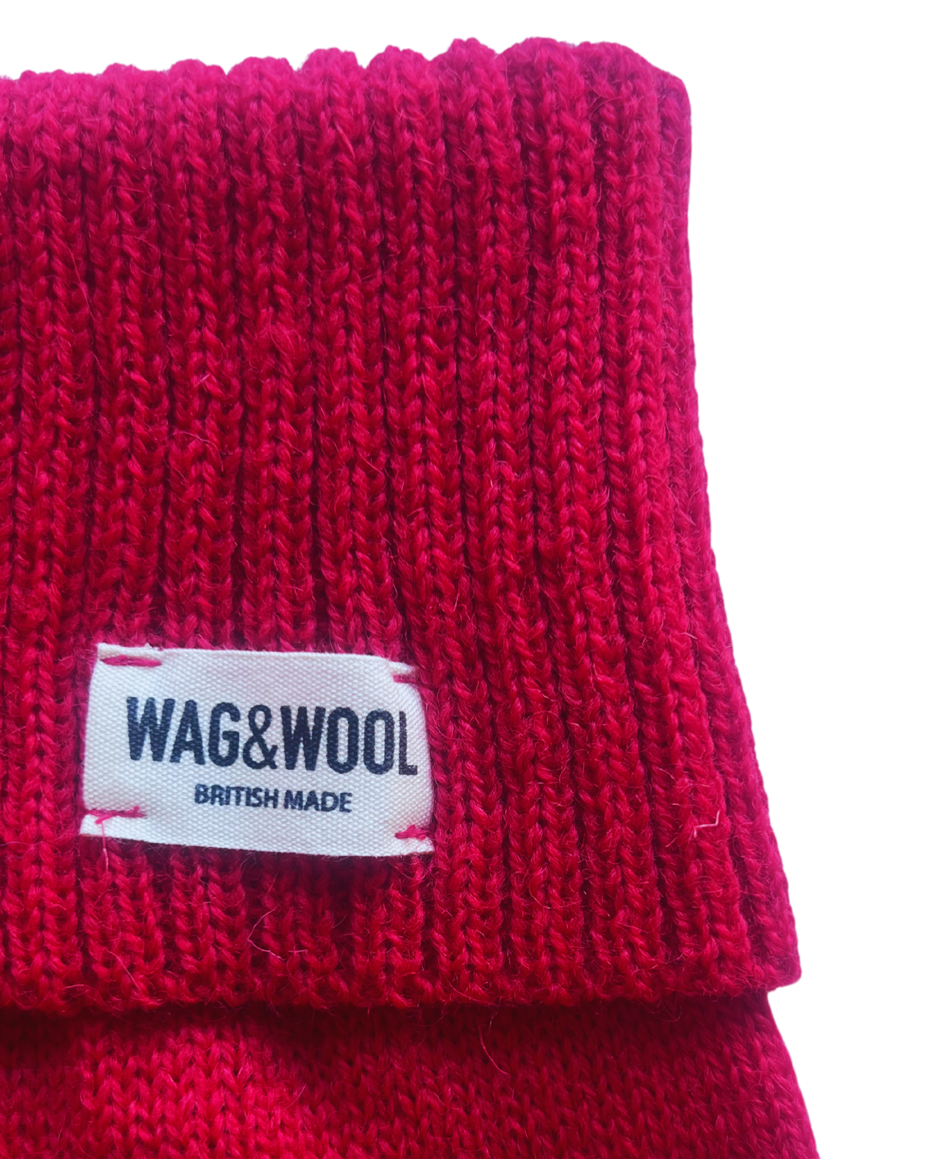 Cherry red dog jumper label close-up