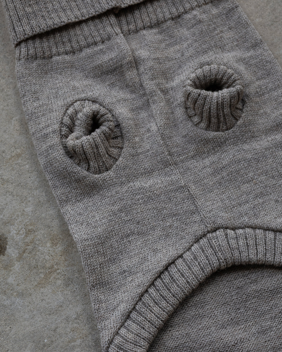 A close-up of a oatmeal pet jumper