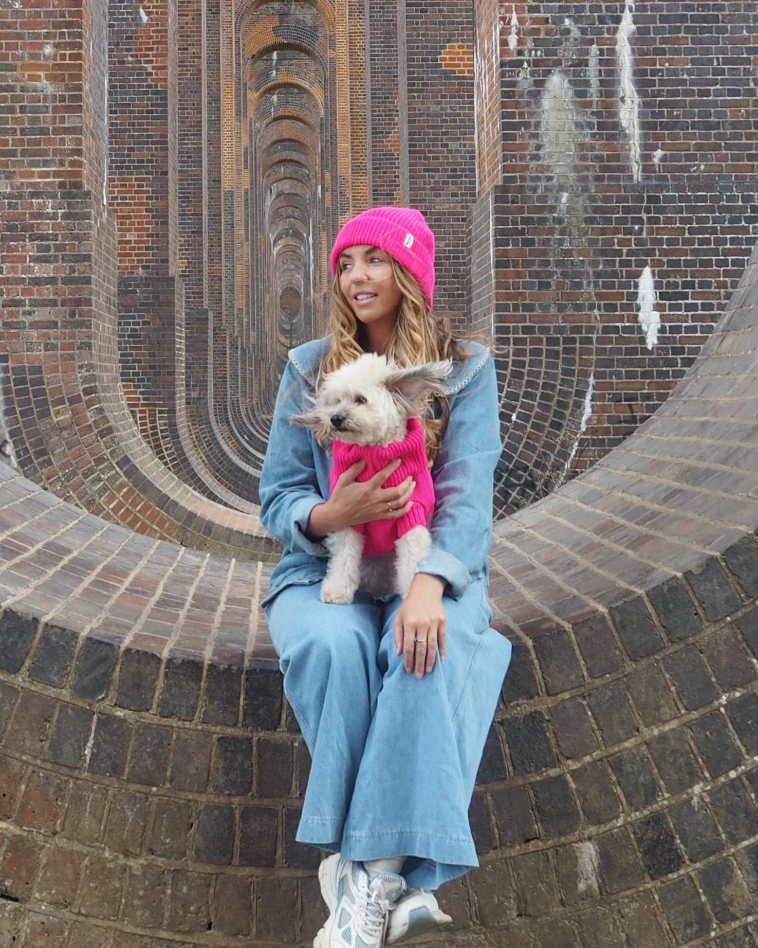 pink woolly hat and dog jumper