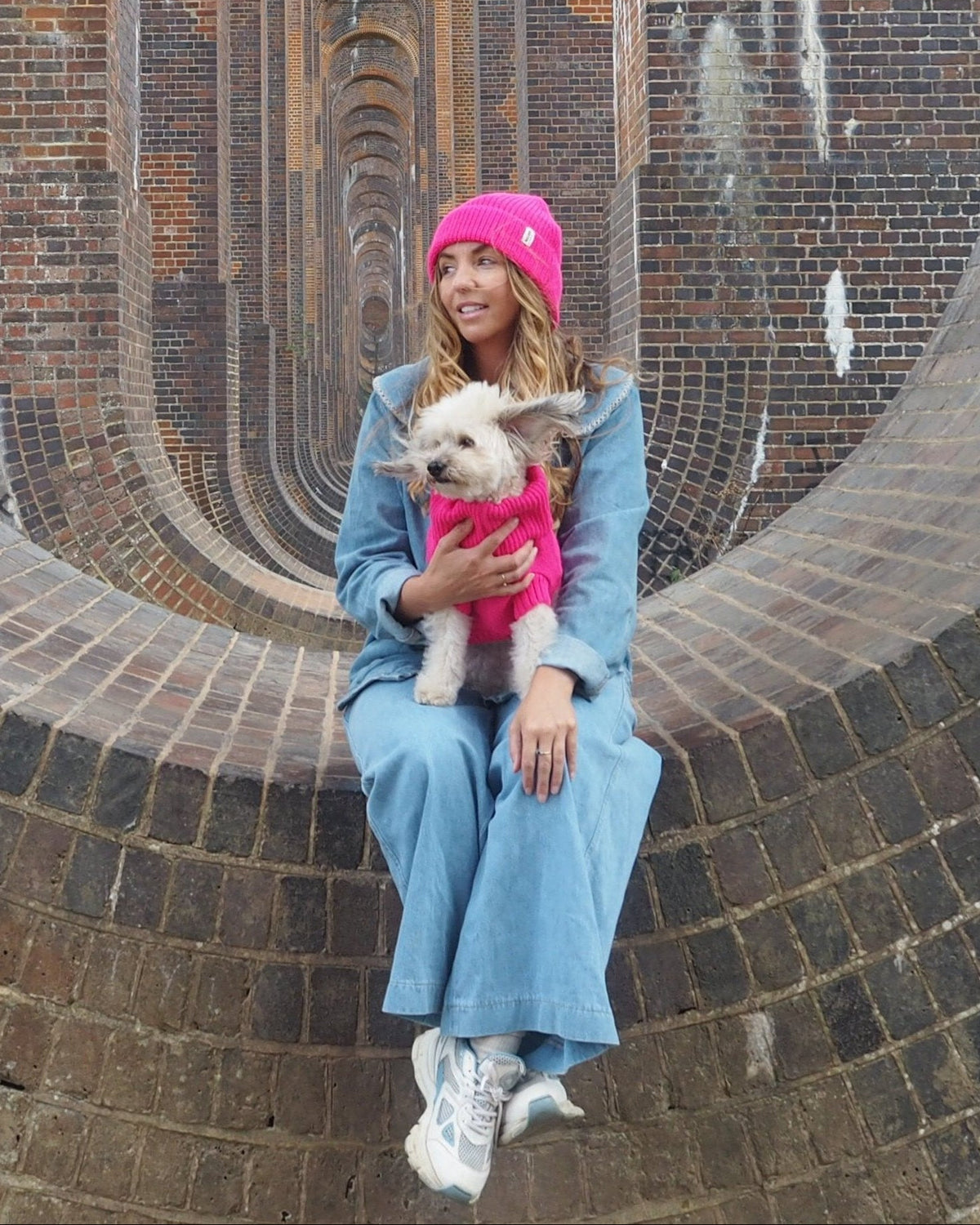 pink woolly hat and dog jumper