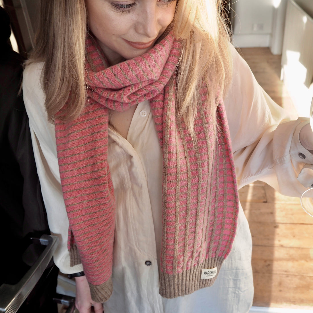 lady in a pink knitted scarf