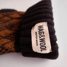 black and brown dog jumper product flat lay