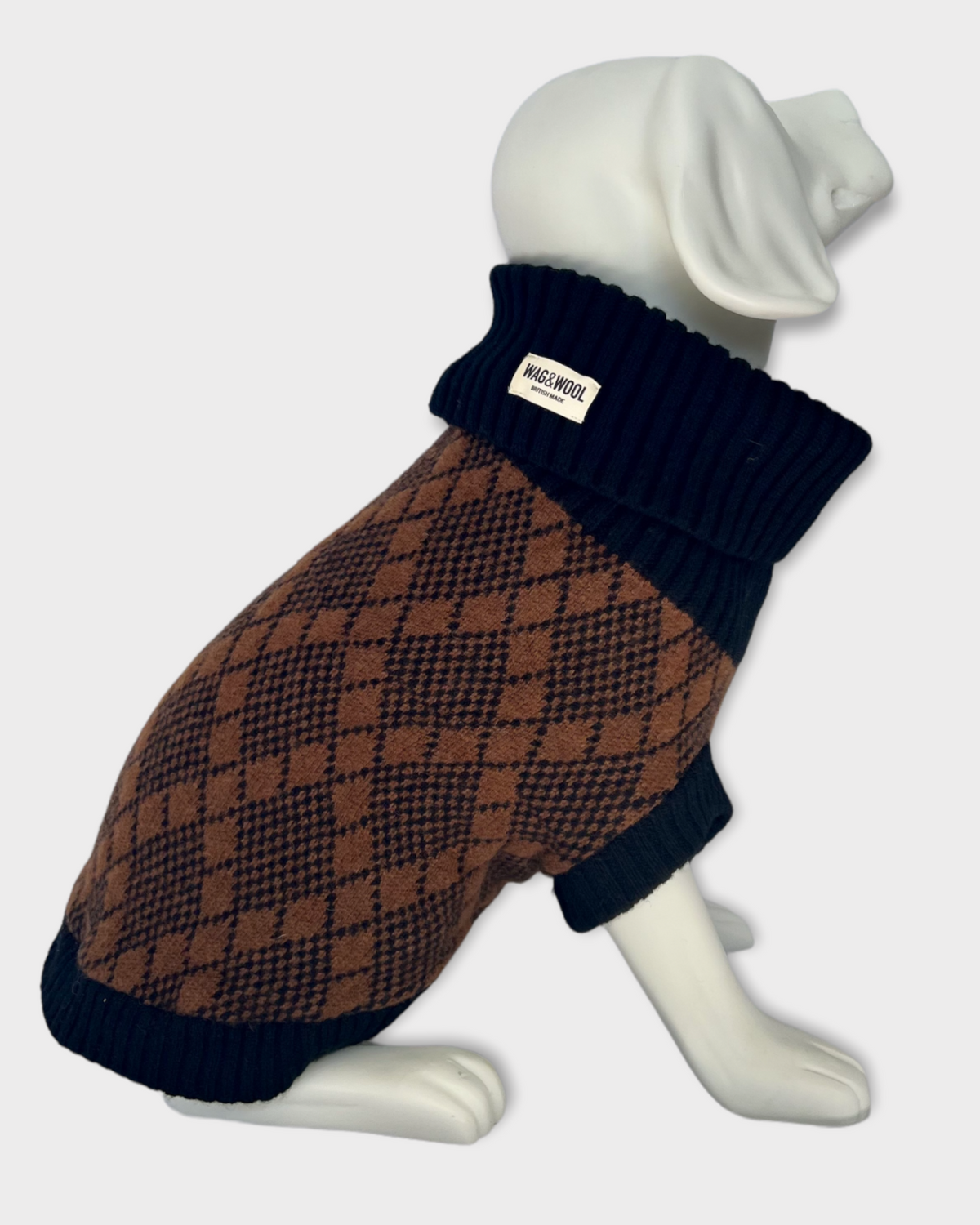 black and brown knitted dog jumper on dog mannequin