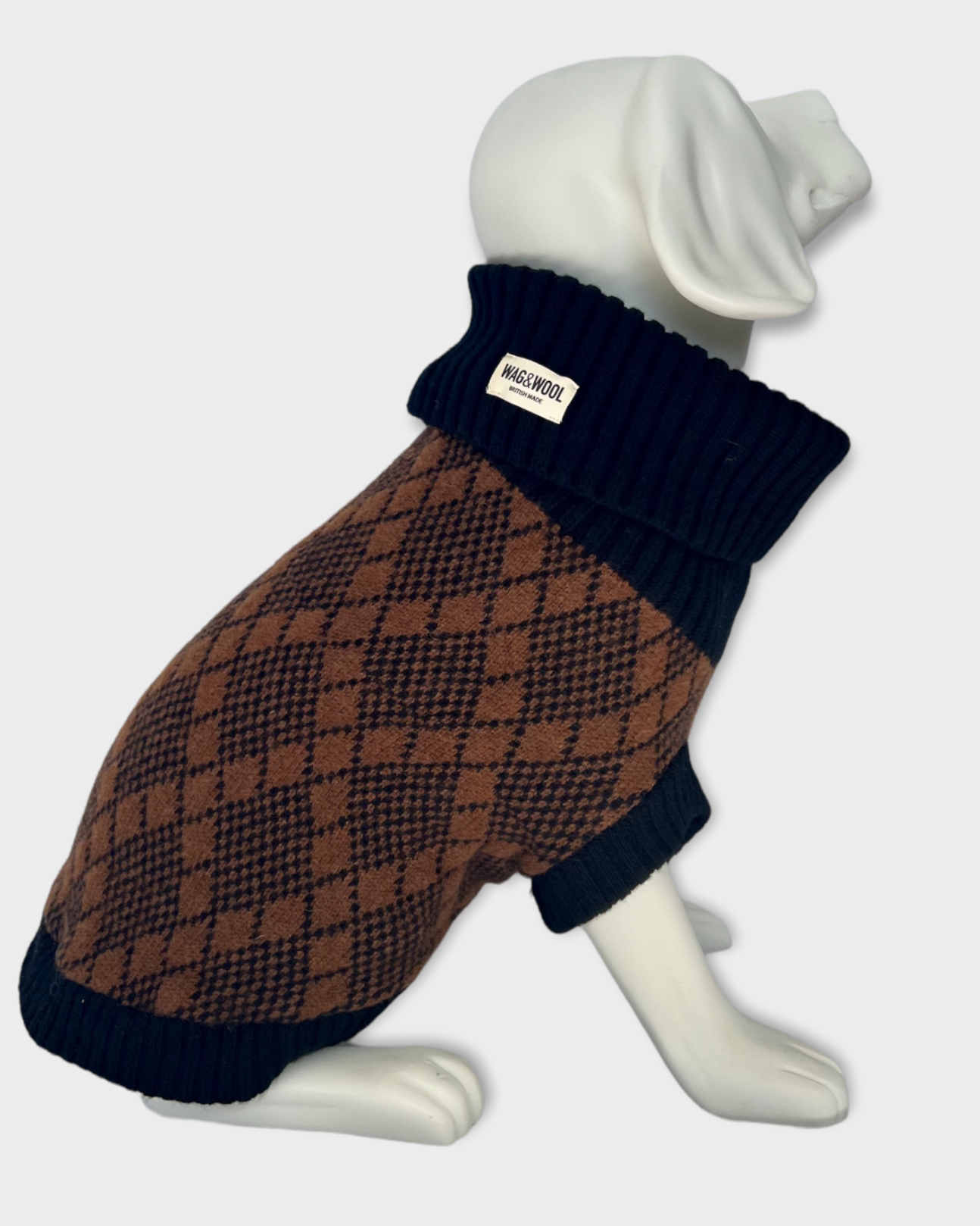 black and brown knitted dog jumper on dog mannequin