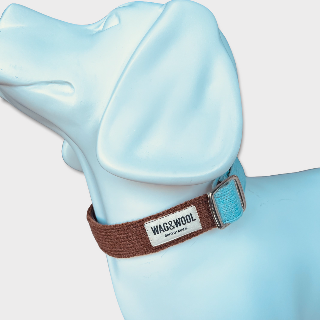 turquoise and brown dog collar on a mannequin
