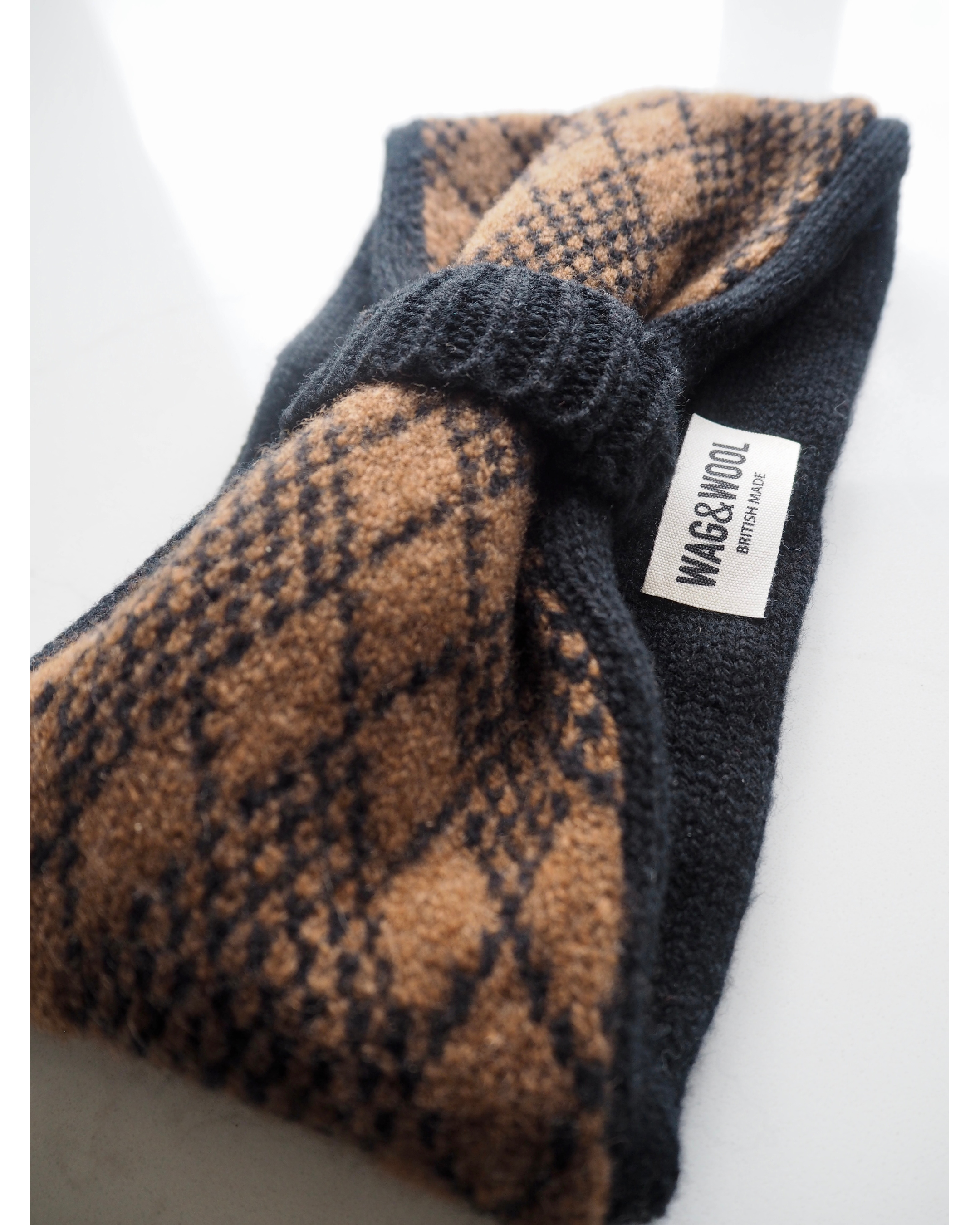 black and brown argyle headband product flat lay