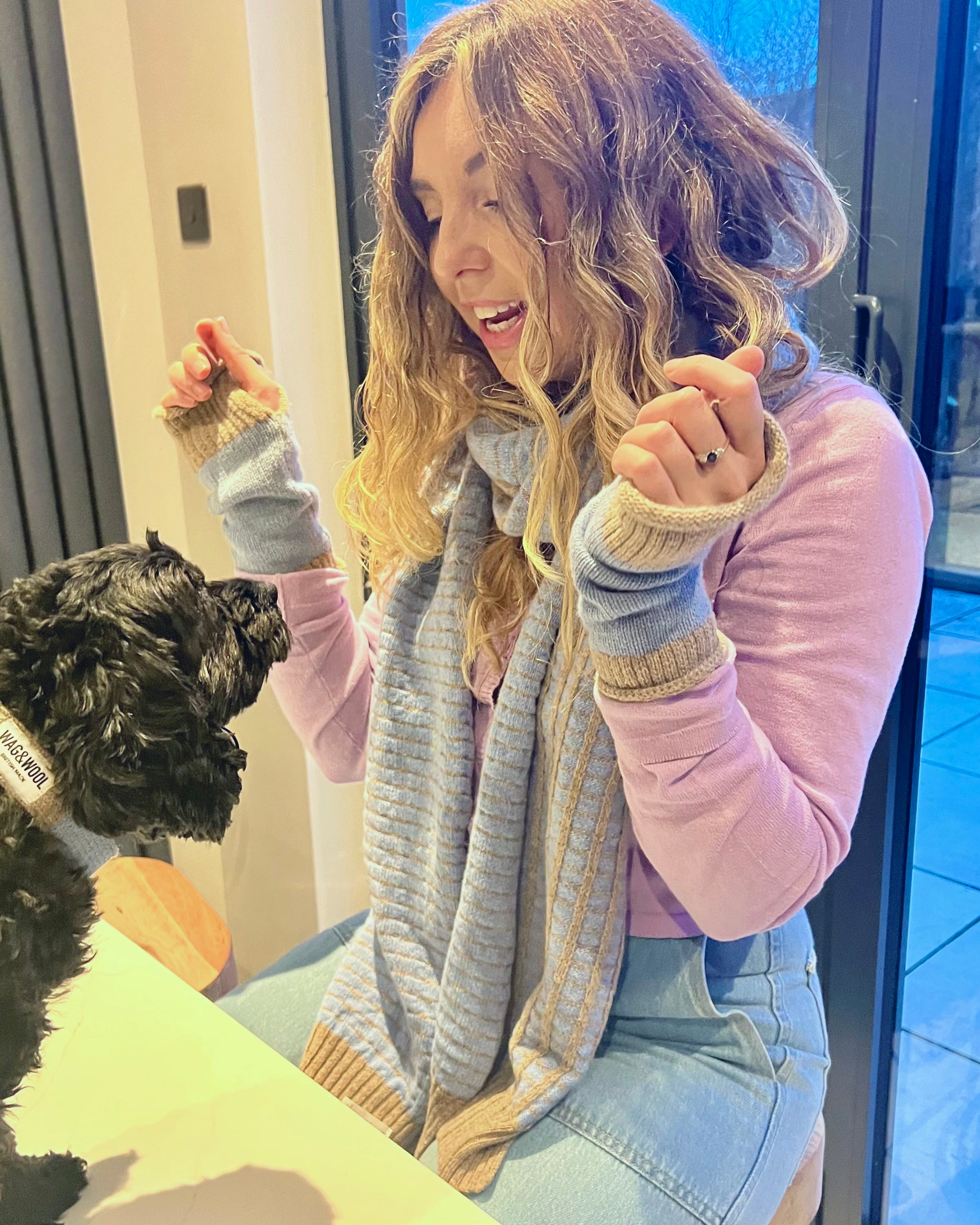 lady and a dog in matching clothes