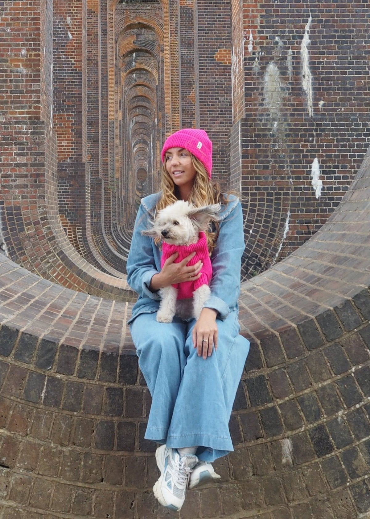pink woolly hat and dog jumper