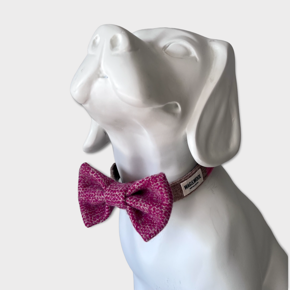 Raspberry Woven Dog Bow Tie on a mannequin