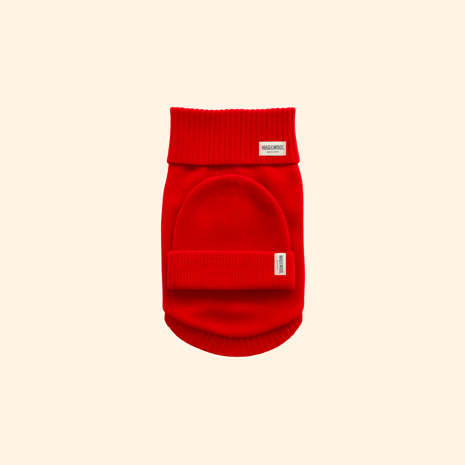 Red dog sweater with a brand label on a beige background