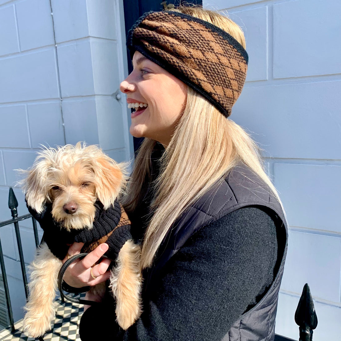 lady holding a small puppy