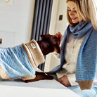 lady and a dog in matching blue accessoriues s 
