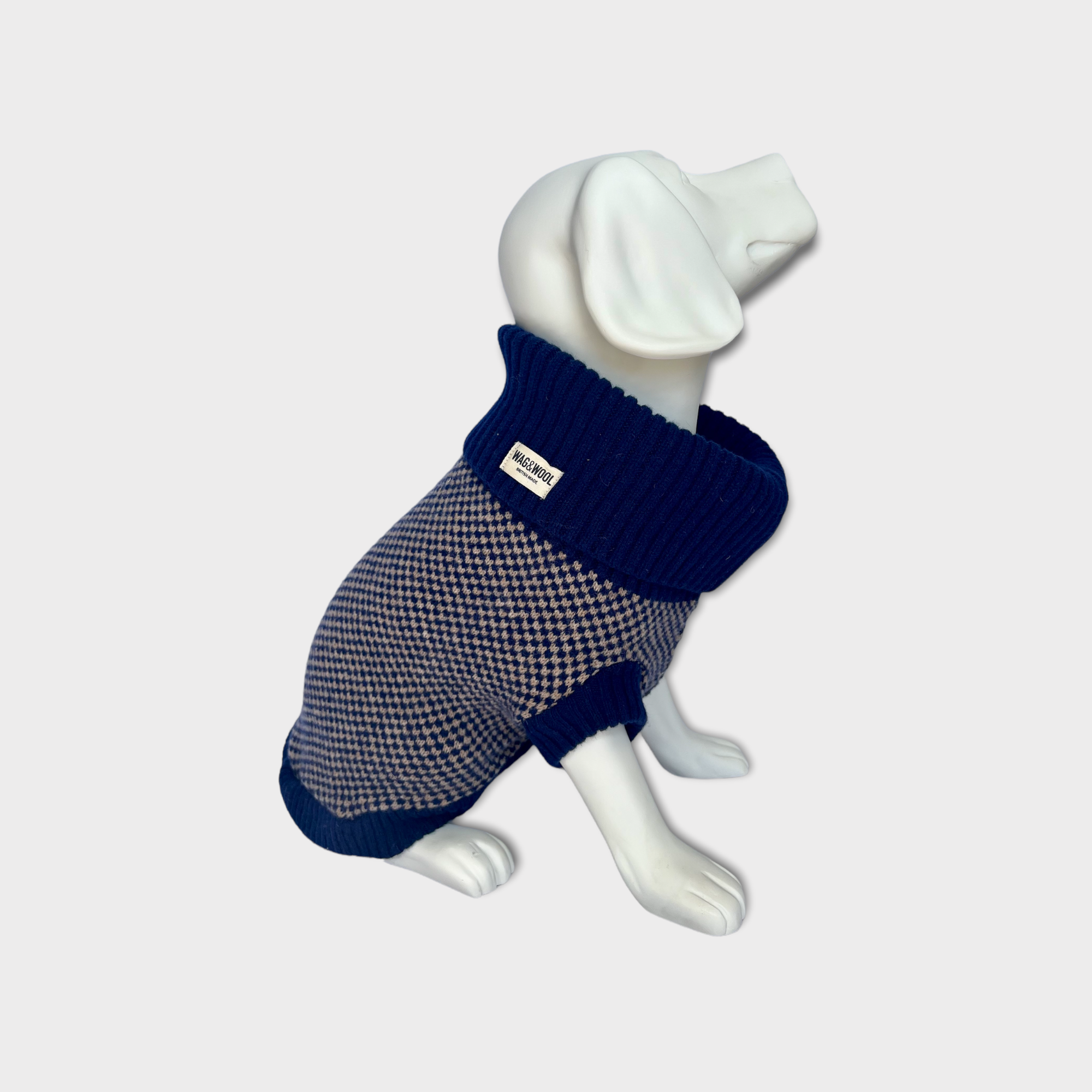 dog mannequin in a navy jumper 