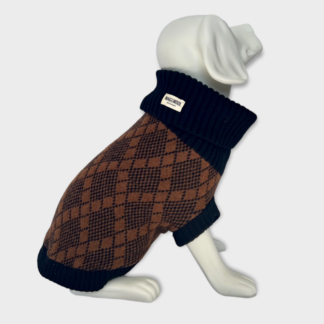 black and brown knitted dog jumper on dog mannequin 