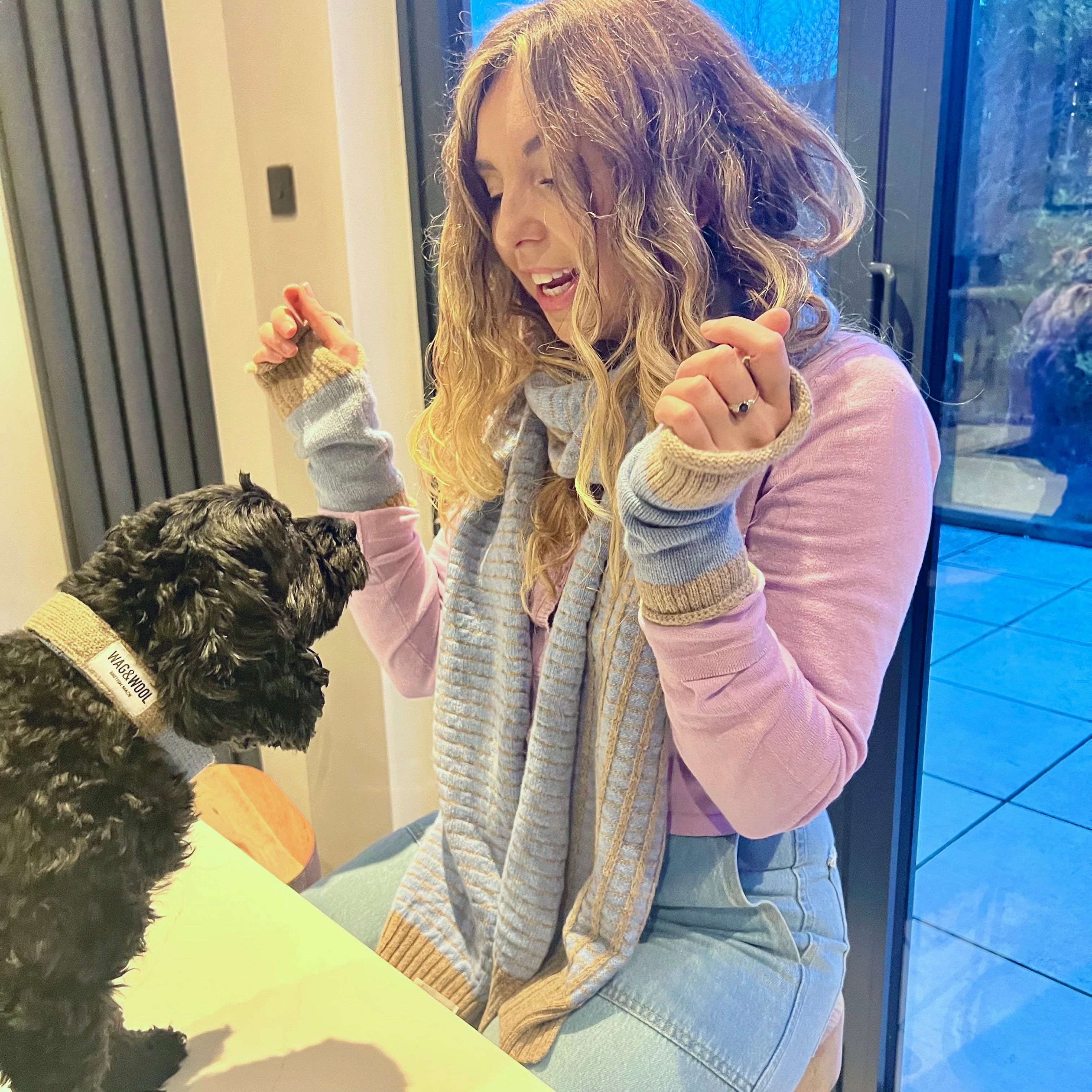 lady and a dog in matching clothes 